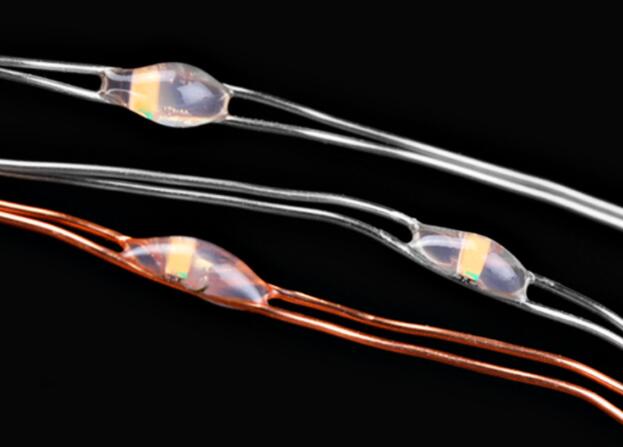 Two transparent 100 200 LED Solar Copper Wire String Light
with embedded copper components on a black background