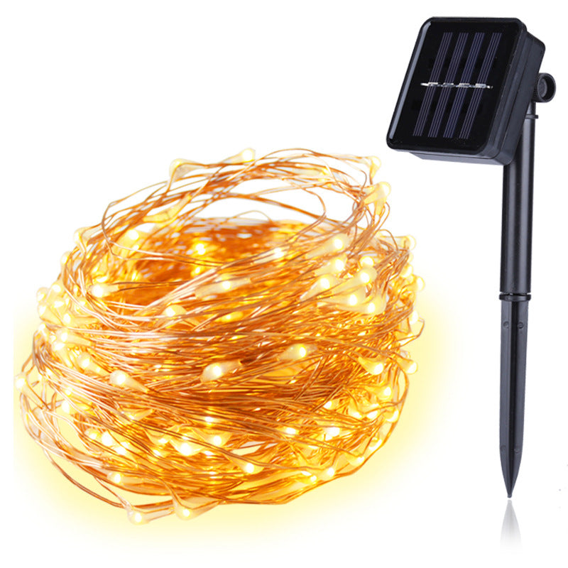 Solar string lights with solar panel and stake on a white background