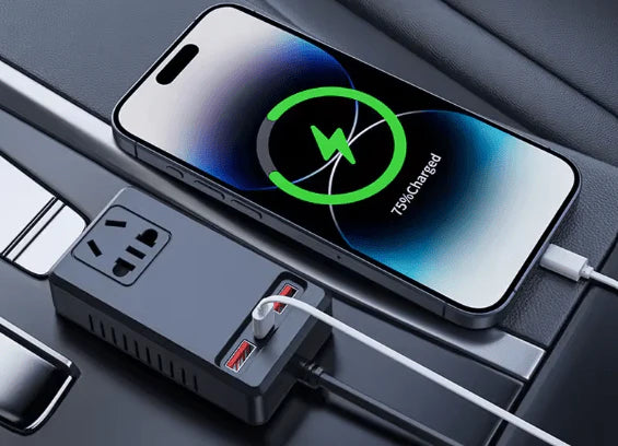 C12 - Intelligent Car Power Inverter with USB Ports Phone with wireless charging pad and power outlet on a car dashboard