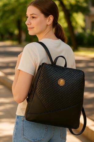 Woman wearing a black Elegant Faux-Leather Backpack outdoors