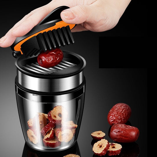 Hand using a Kitchen Gadget With Integrated Fruit Cutter to chop dried fruits on a dark background