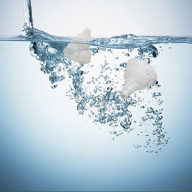 Two white silicon suction tube of Baby Nasal Aspirator Electric Cleaning Household, floating on water with bubbles.