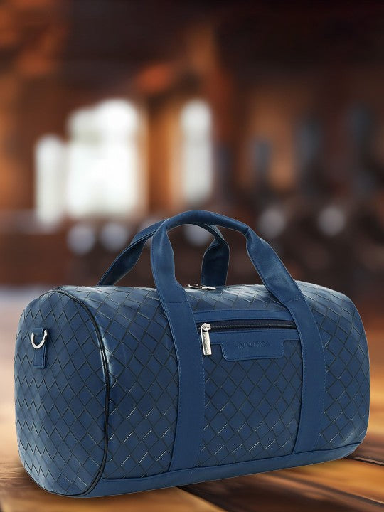 Blue woven Nautica - Casual Duffel Bag on a wooden surface with a blurred background