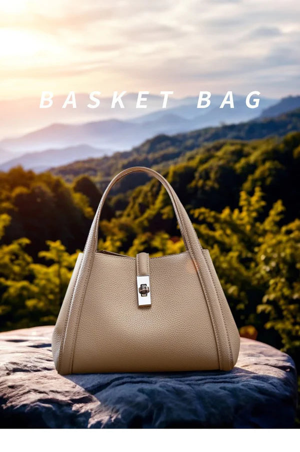 Beige color fashionable Korean style large capacity leather handbag on a rock with a scenic background of mountains and trees