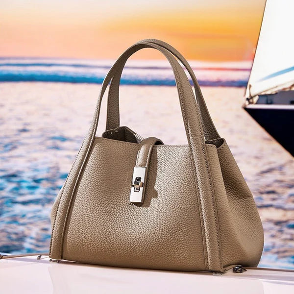 fashionable Korean style large capacity leather Beige color handbag on a boat with a scenic background
