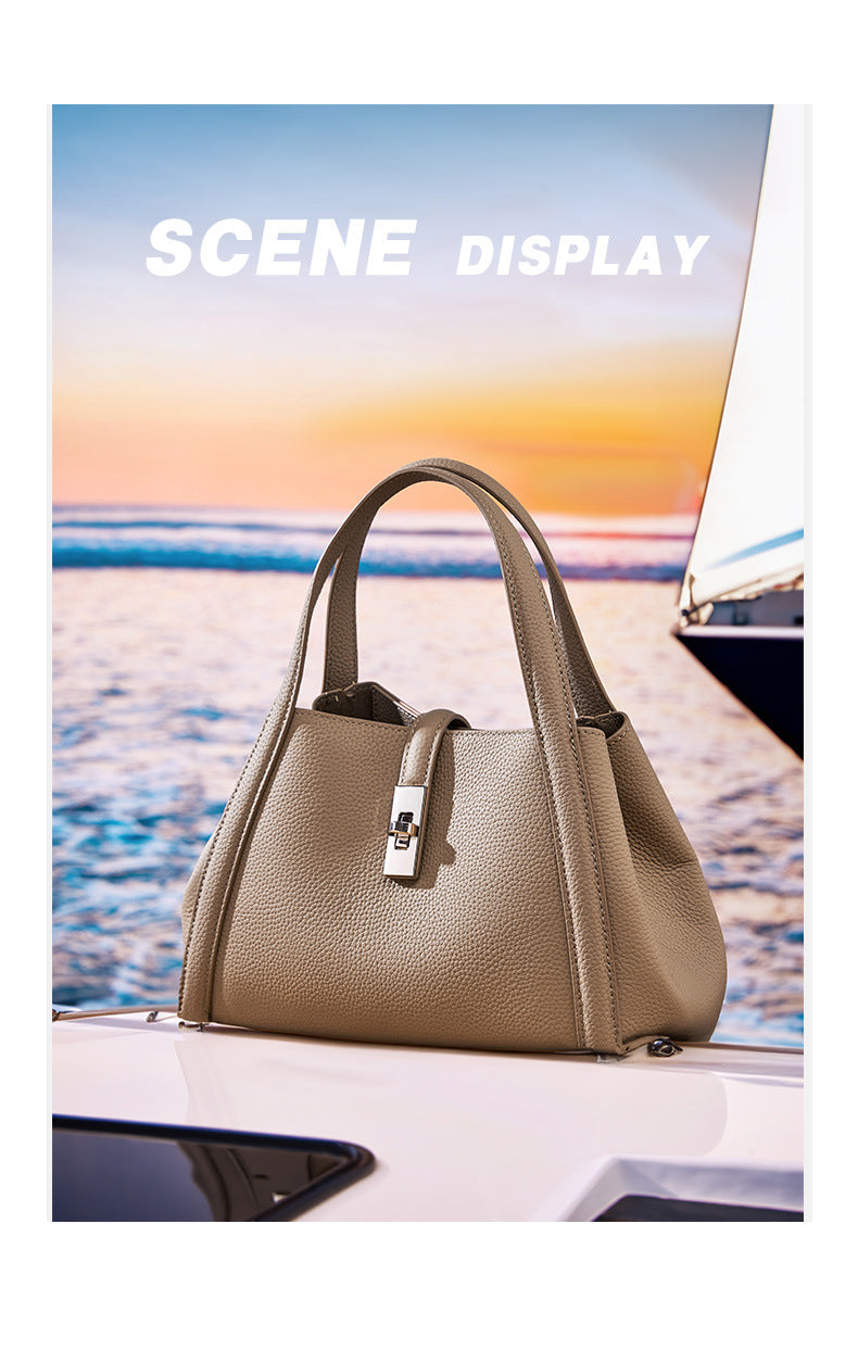 Beige color fashionable Korean style large capacity handbag on a car hood with a scenic background