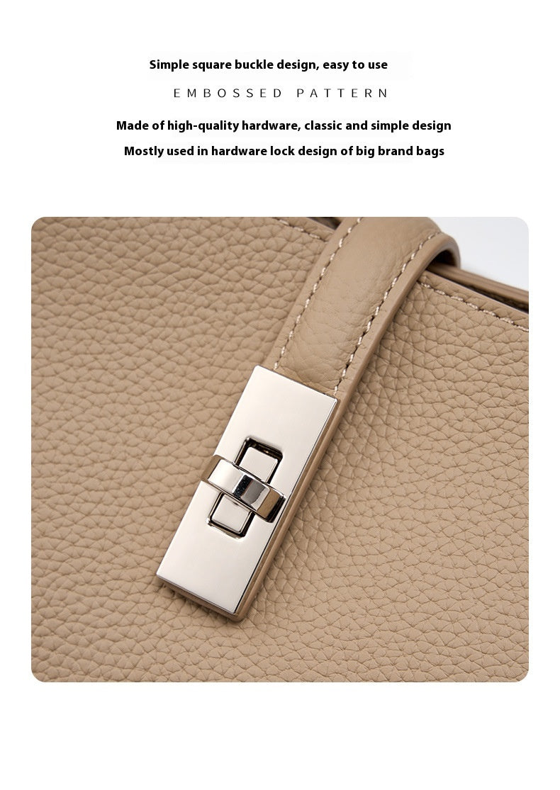 Close-up of a beige color fashionable Korean style  large capacity  leather bag with a silver buckle on a white background