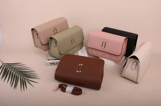 Collection of colorful Flap Shoulder Bag on a light pink background with a palm leaf.