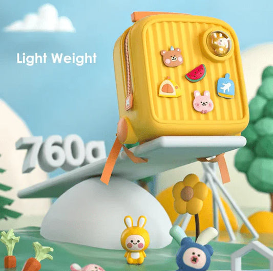 Yellow Kids Travel Backpack with cartoon character stickers on a playground background