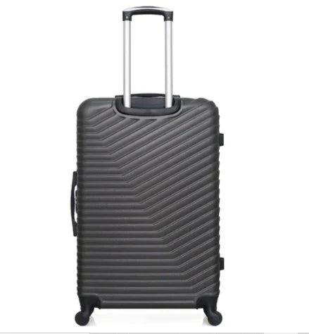 Gray Luggage For Travelling suitcase with a textured surface on a white background