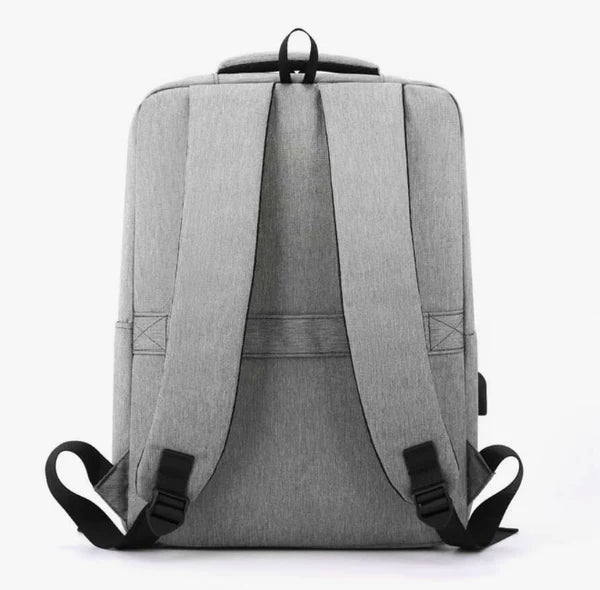 Gray "nylone back pack" backpack with black straps on a white background