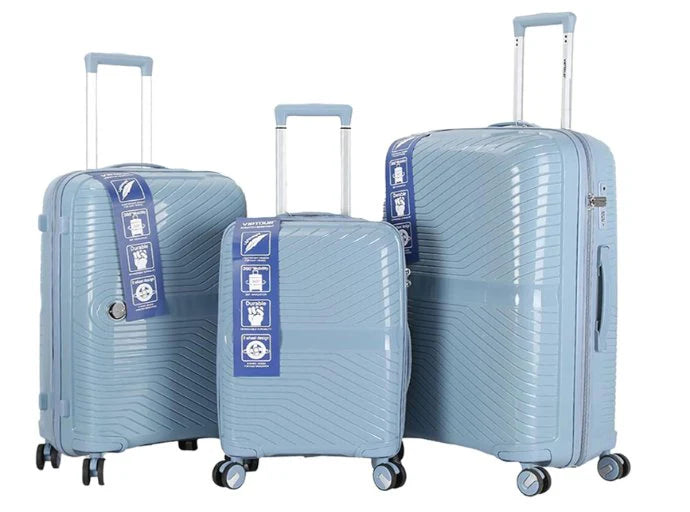 Three light blue VIP tour luggage suitcases of different sizes on a white background